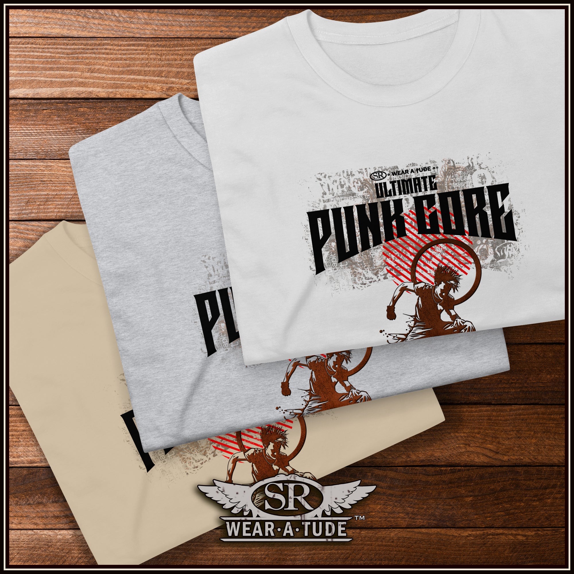 Two t-shirts with graphic designs on a wooden surface, featuring the brand &