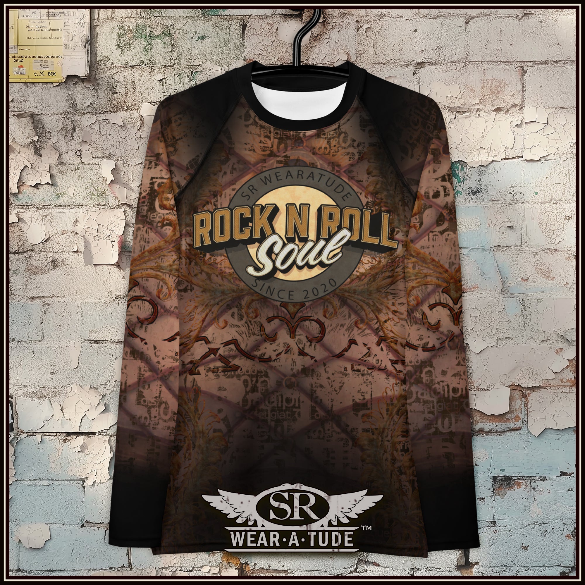 Rock and roll inspired women’s rashguard shirt with bold SR Wear·A·Tude logo.