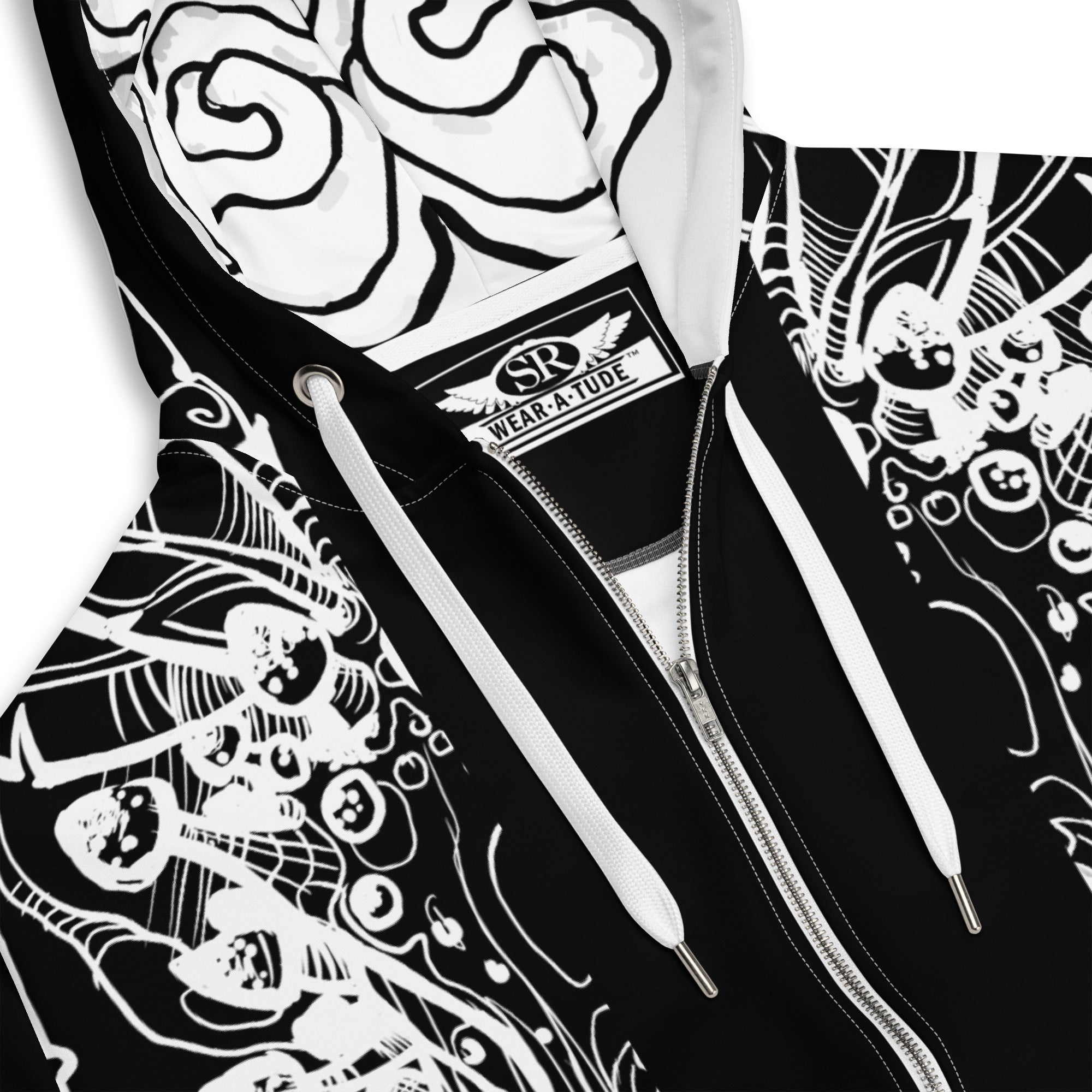 Close-up of Static Reaper hoodie fabric showing detailed white circuit-skull linework and smooth black metal streetwear texture.