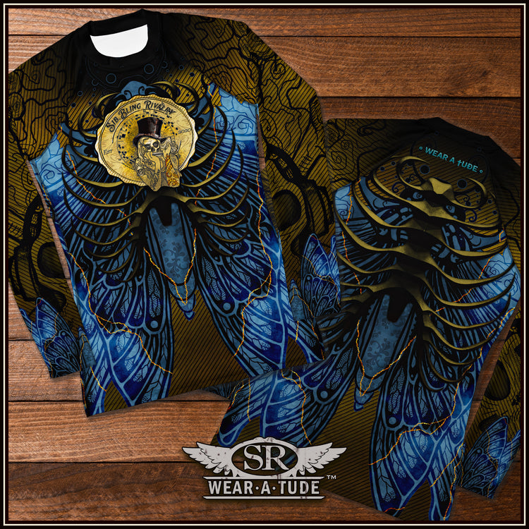 Our&nbsp; Midnight Voodoo rashguard features a captivating design. The chest has our iconic Voodoo harmonica woman, symbolizing strength and empowerment. The deep black, blue, and gold designs intricately embellished on the arms and body add a touch of sophistication and flair, making a bold statement both on and off the stage. Constructed from a high-performance smooth fabric blend, this rashguard offers a luxurious feel against your skin, allowing for unrestricted movement during your activities. 
