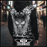 Back of a black metal hoodie with white skull circuitry design and SR WearAtude sleeve print on a night street background.