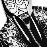 Close-up of Static Reaper hoodie fabric showing detailed white circuit-skull linework and smooth black metal streetwear texture.
